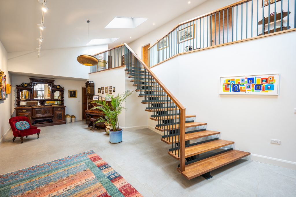 Staircase and hall at The Grain Barn, Tibberton, Gloucestershire