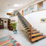 Staircase and hall at The Grain Barn, Tibberton, Gloucestershire